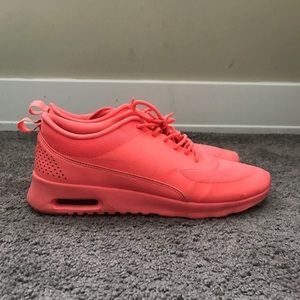 Bright coral sneakers